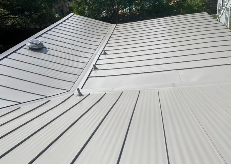 Solar attic fan installed on a metal roof for Roof Ventilation in Doffing
